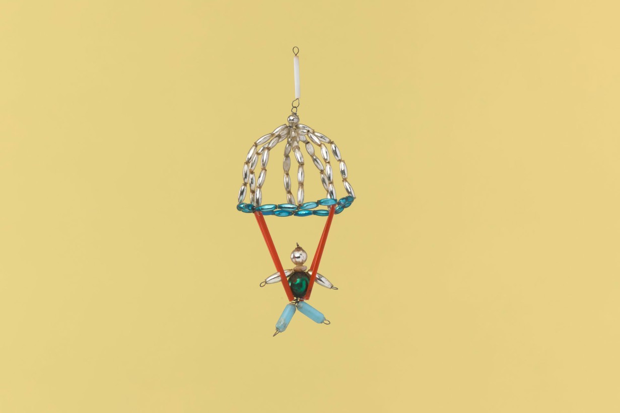 Christmas tree decoration made of beads and glass bugles with wire in shape of a skydiver 