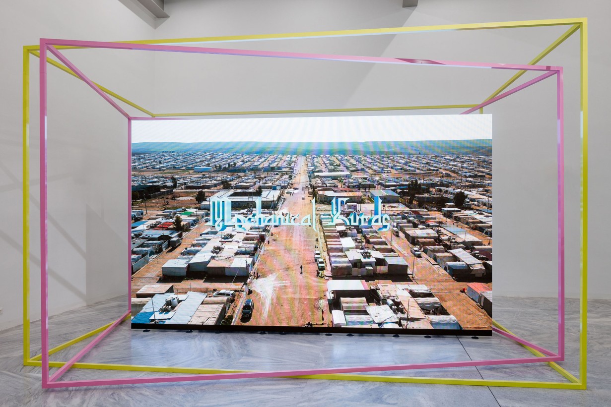 Exhibition room with screen of the Mechanical Kurds shows