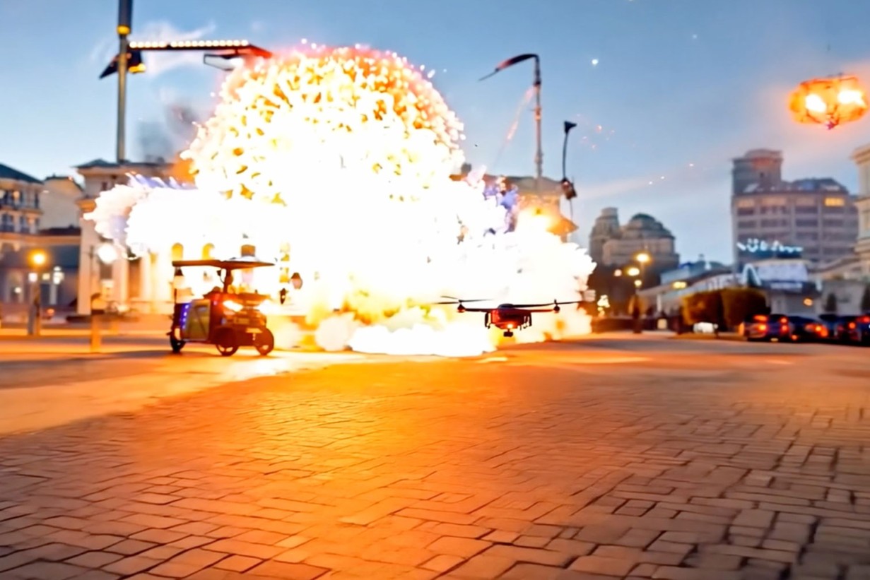 Film still, exploding cars