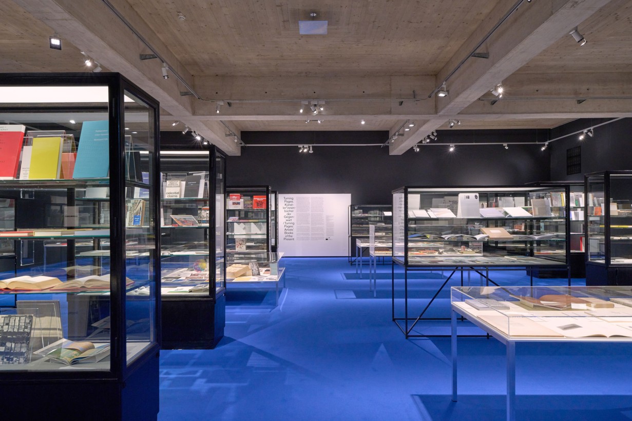 Exhibition space with display cases and books